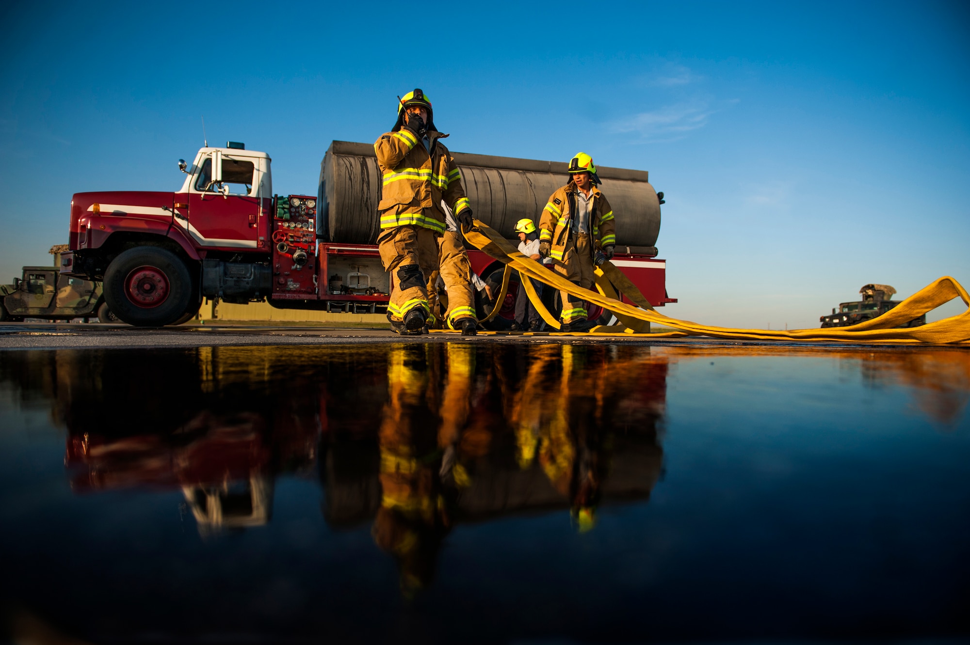 Firefighters from the 39th Civil Engineer Squadron Incirlik Fire Emergency Services, participate in an emergency response exercise Dec. 16, 2014, at Incirlik Air Base, Turkey. Units across base participated in the exercise to ensure they are trained and ready for emergencies at a moment’s notice. (U.S. Air Force photo by Airman Cory W. Bush/Released)