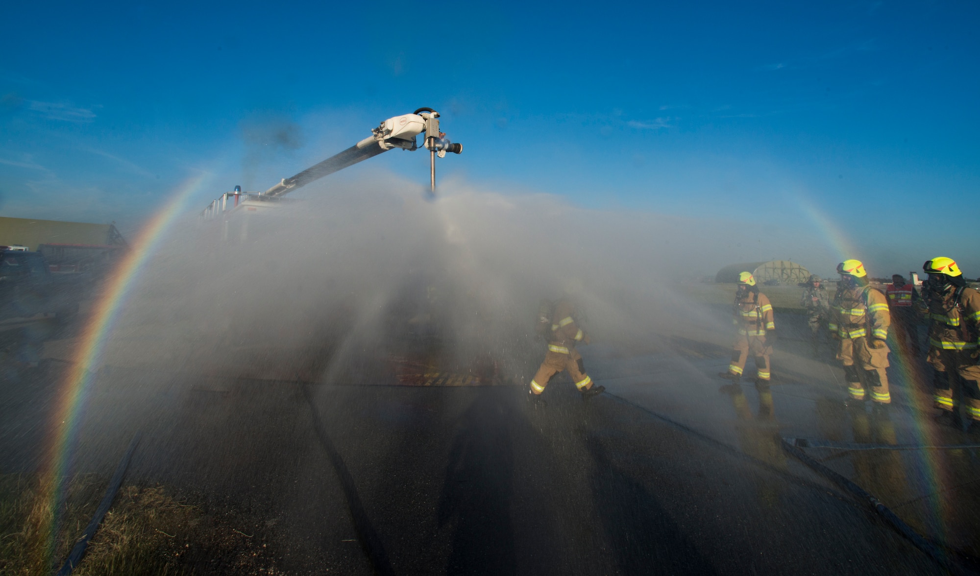 Firefighters from the 39th Civil Engineer Squadron Incirlik Fire Emergency Services, simulate decontamination processes during an emergency response exercise Dec. 16, 2014, at Incirlik Air Base, Turkey. Decontamination training is vital to ensure responders and aware of procedures if they were to be exposed to hazardous chemicals during a real world emergency. (U.S. Air Force photo by Airman Cory W. Bush/Released)