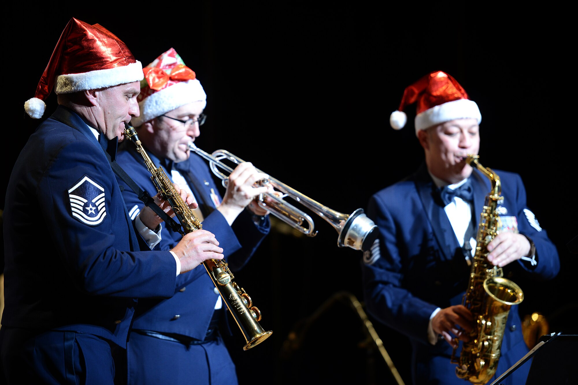 Members of the U.S. Air Force Band of the Pacific-Asia jazz band perform during a concert in Naha City, Japan, Dec. 11, 2014. The band, which is stationed at Yokota Air Base, Japan, as part of the Pacific Air Forces Band, held the concert off-base for more than 450 Okinawan citizens. The band hosted four concerts at local sites around the island during their stay. (U.S. Air Force photo by Senior Airman Maeson L. Elleman)