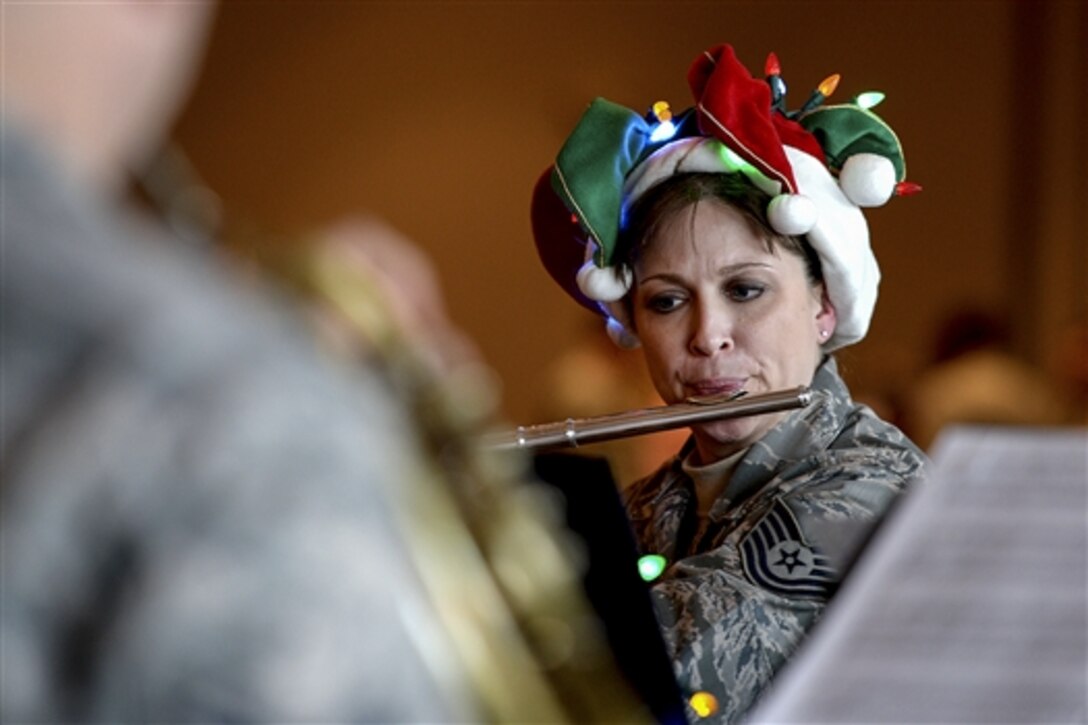 Air Force Tech. Sgt. Jennifer James plays the flute during a performance on Scott Air Force Base, Ill., Dec. 17, 2014. 
