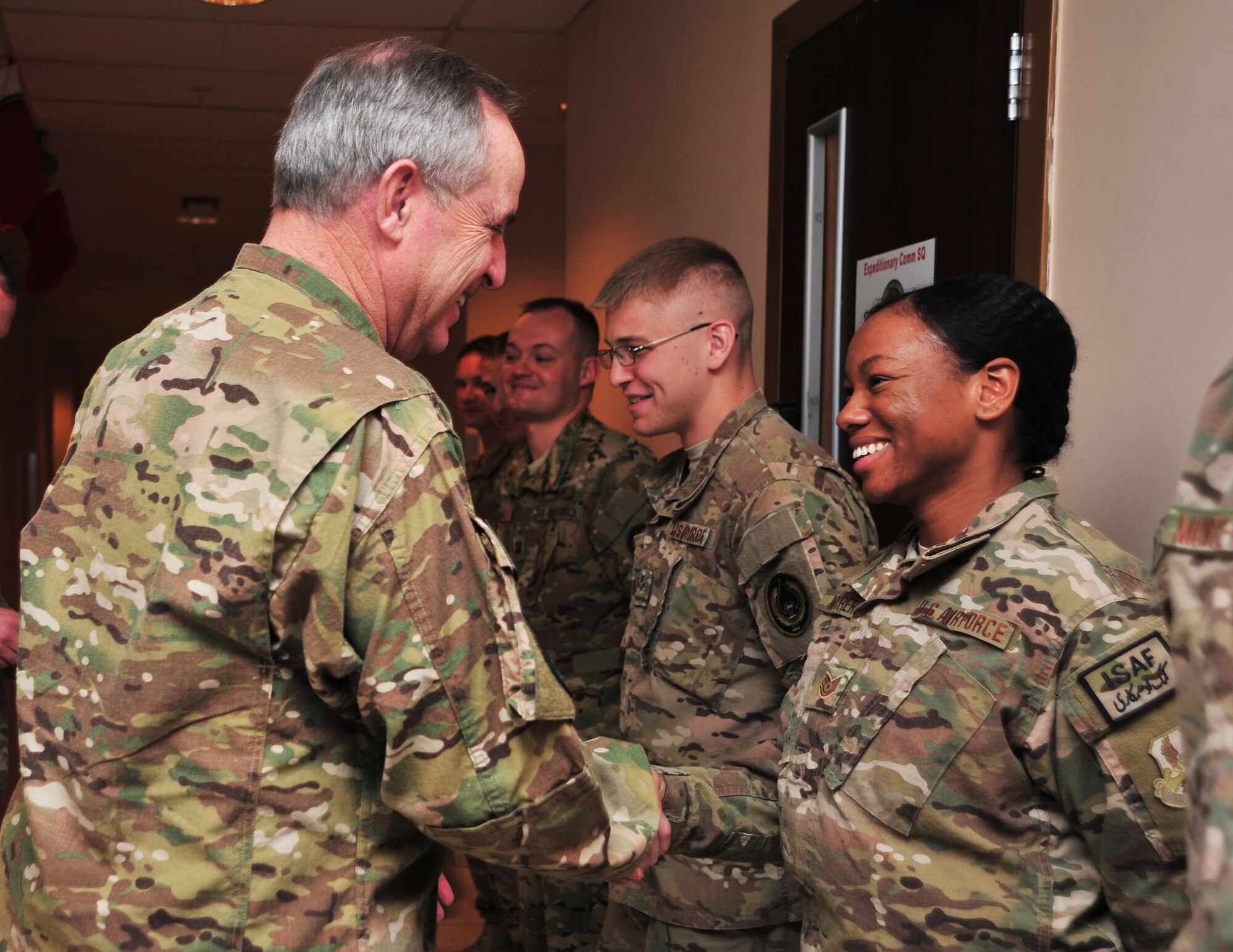 U.S. Air Force Chief of Staff Gen. Mark A. Welsh III shakes hands with U.S. Air Force Tech. Sgt. Delora Moorer, 455th Air Expeditionary Wing command chief executive assistant, after he recognized the Airman Dec. 15, 2014 at Bagram Airfield, Afghanistan. Welsh spent a portion of his visit to the Air Forces Central Command area of responsibility engaging with airmen, NCOs and officers during an Airman’s Call. (U.S. Air Force photo by Staff Sgt. Whitney Amstutz/released) 