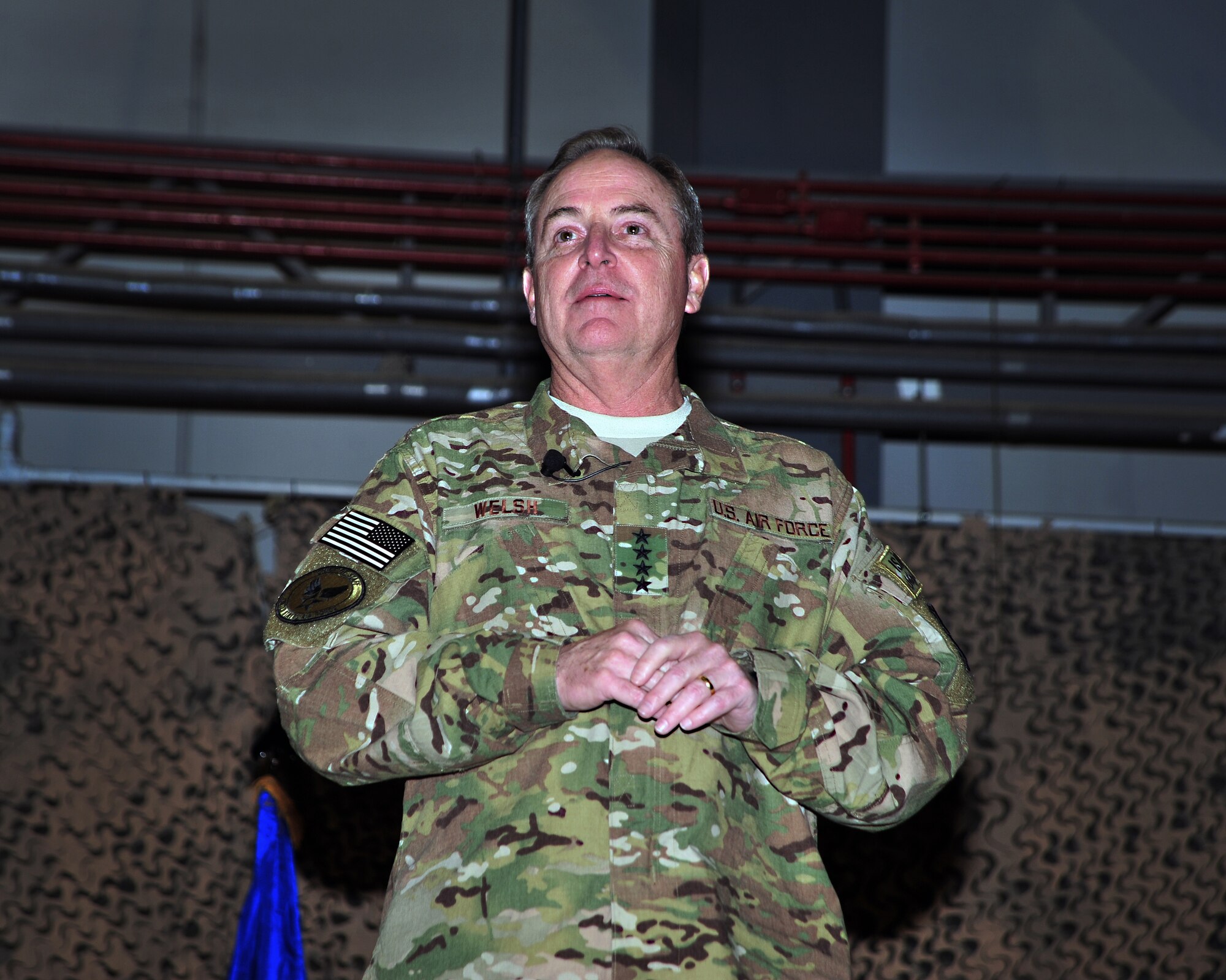 U.S. Air Force Chief of Staff Gen. Mark A. Welsh III speaks to Airmen during an all-call Dec. 15, 2014 at Bagram Airfield, Afghanistan. During the visit, which included the chief of staff’s wife, Betty, Welsh spoke with Airmen, listened to their stories of service, updated them on pressing issues facing the Air Force, and thanked them for their service. (U.S. Air Force photo by Staff Sgt. Whitney Amstutz/released)