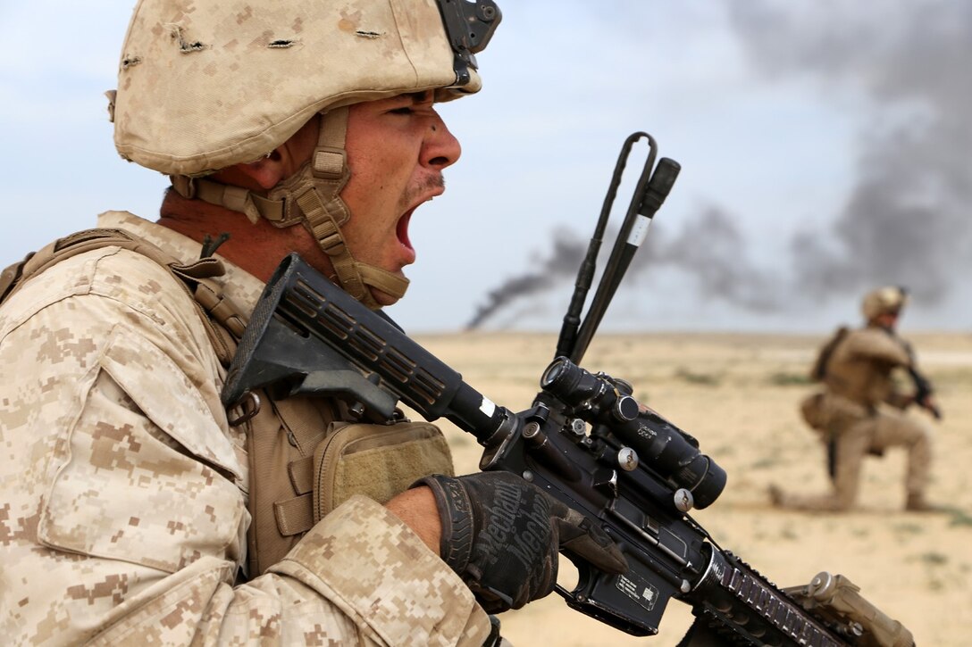U.S. Marine Corps Cpl. Ty-Michael Maes, left, a team leader with the 1st Light Armored Reconnaissance detachment, Battalion Landing Team, 2nd Battalion, 1st Marines, 11th Marine Expeditionary Unit, and native of Lindenhurst, New York, directs his fire team during a bilateral live-fire assault exercise with Saudi Marines as part of exercise Red Reef 15 in Ras Al Khair Saudi Arabia. Red Reef is part of a routine theater security cooperation engagement plan between the U.S. Navy, U.S. Marine Corps and Royal Saudi Naval Forces that serves as an excellent opportunity to strengthen tactical proficiency in critical mission areas and support long-term regional security. (U.S. Marine Corps photos by Gunnery Sgt. Rome M. Lazarus/Released)