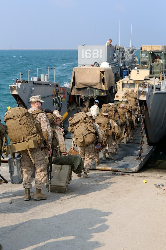 Marines and Sailors with the 11th Marine Expeditionary Unit, board a landing craft utility (LCU) en route to the dock landing ship USS Comstock (LSD 45) following exercise Red Reef 15 in Ras Al Ghar, Saudi Arabia. Red Reef is part of a routine theater security cooperation engagement plan between the U.S. Navy, U.S. Marine Corps and Royal Saudi Naval Forces that serves as an excellent opportunity to strengthen tactical proficiency in critical mission areas and support long-term regional security. (U.S. Marine Corps photo by Sgt. Melissa Wenger/Released)