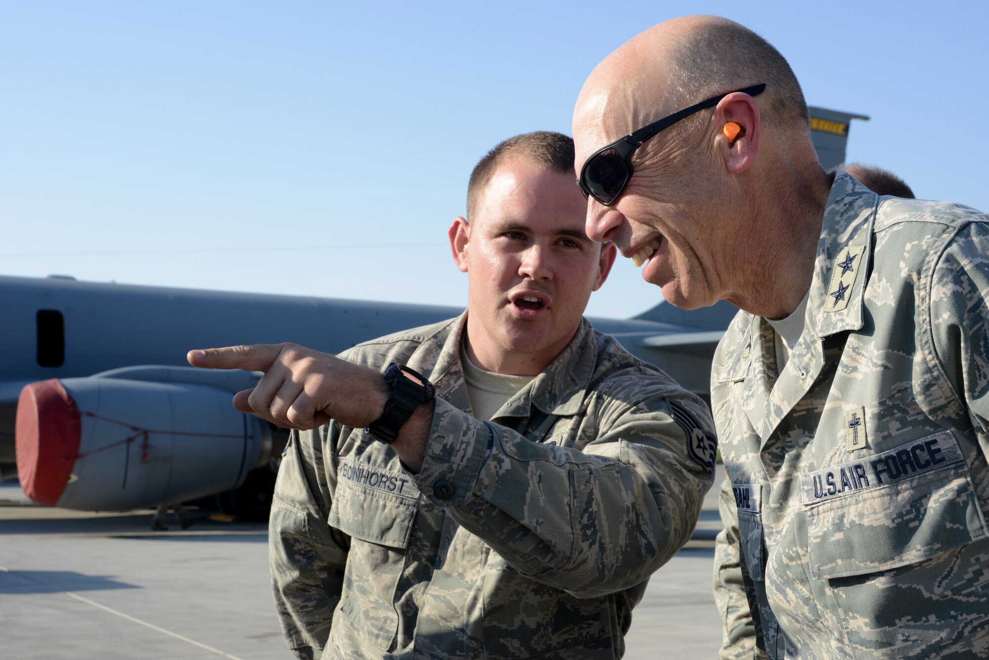 U.S. Air Force Staff Sgt. Samuel Bonhorst, left, 379th Expeditionary Logistics Readiness Squadron, explains his job to Air Force Chief of Chaplains, Maj. Gen. Howard Stendhal, Dec. 21, 2014, at Al Udeid Air Base, Qatar. Stendahl and Chaplain Assistant Career Field Manager, Chief Master. Sgt. Dale McGavran, spoke with Airmen and toured chaplain programs supporting Air Force Central Command operations during their visit here. Stendahl thanked volunteers and religious groups for their support of Airmen deployed to Al Udeid. Bonhorst is deployed from Fairchild Air Force Base, Wash. (U.S. Air Force photo by Senior Airman Kia Atkins)