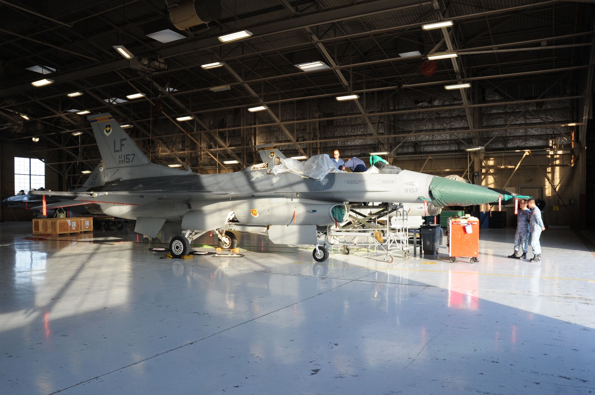 An F-16D Fighting Falcon undergoes repairs to the longeron due to cracks Dec. 11, 2014, at Luke Air Force Base, Ariz. This is one of the last aircraft of 32 to be repaired. (U.S. Air Force photo/Staff Sgt. Luther Mitchell Jr.)