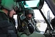 Maj. Mary Clark instructs 1st Lt. David Shadoin during pre-flight procedures Dec. 16, 2014, at Shindand Air Base, Afghanistan. Clark is an UH-1N Huey instructor pilot and the 58th Operations Support Squadron's assistant director of operations, and Shadoin a student pilot in the 512th Special Operations Squadron. (U.S. Air Force photo/Jim Fisher)