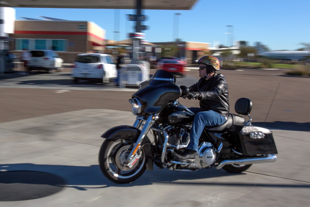 Master Sgt. Christopher Rosenfelt, the Headquarters and Headquarters Squadron Motorcycle Club vice president, rides his motorcycle aboard Marine Corps Air Station Miramar, Calif., before a special ride to Rady Children’s Hospital in San Diego, Dec. 22. Newer riders ride with veteran motorcyclists to learn from them and gain experience during these rides. But it was the box full of toys and their destination at Rady Children’s Hospital – San Diego that truly mattered to them.