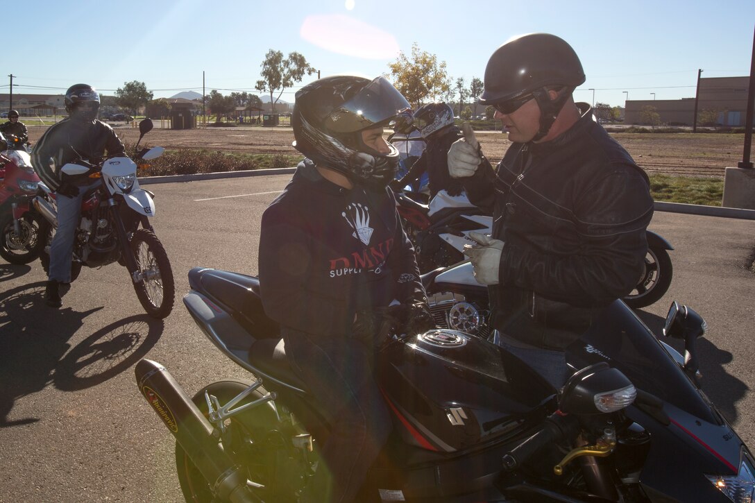 Master Sgt. Gary Greenbush, the outgoing Headquarters and Headquarters Squadron Motorcycle Club president, gives instructions to a motorcycle rider aboard Marine Corps Air Station Miramar, Calif., before a special ride to Rady Children’s Hospital in San Diego, Dec. 22. Experienced riders like Greenbush passed their knowledge and experience to junior riders so that they can ride safer.