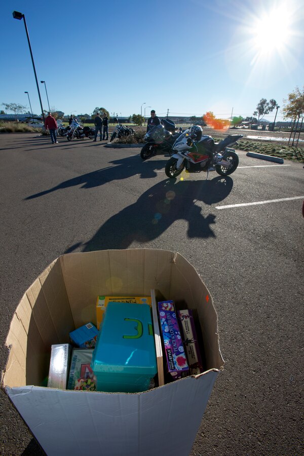 A box of toys gathered by Headquarters and Headquarters Squadron Motorcycle Club members sits in the Gonzales Gas Station parking lot aboard Marine Corps Air Station Miramar, Calif., while members gather for a special ride to Rady Children’s Hospital in San Diego, Dec. 22. The club gathered 153 toys for children at the hospital for the start of what they hope will become a long-standing tradition.