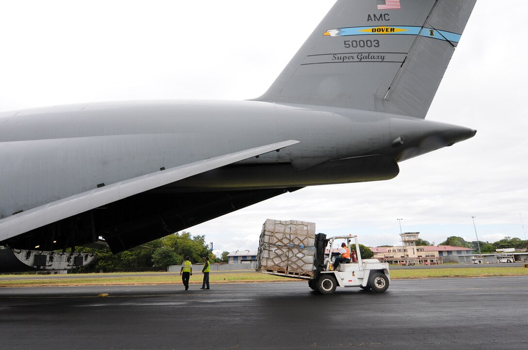 Reserve Airmen from the 512th Airlift Wing deliver humanitarian supplies to Nicaragua aboard a C-5M Super Galaxy Dec. 20, 2014, just in time for the holidays. The massive delivery was made possible through the Denton Program, a Defense Department humanitarian assistance transportation program that utilizes space available military air, surface and sea-lift assets. The supplies were provided to World Missions Outreach, which is an international nonprofit organization based in Nicaragua that provides food, education, medical and ministry services to the country's citizens. (U.S. Air Force photo/2nd Lt. Steve Lewis)