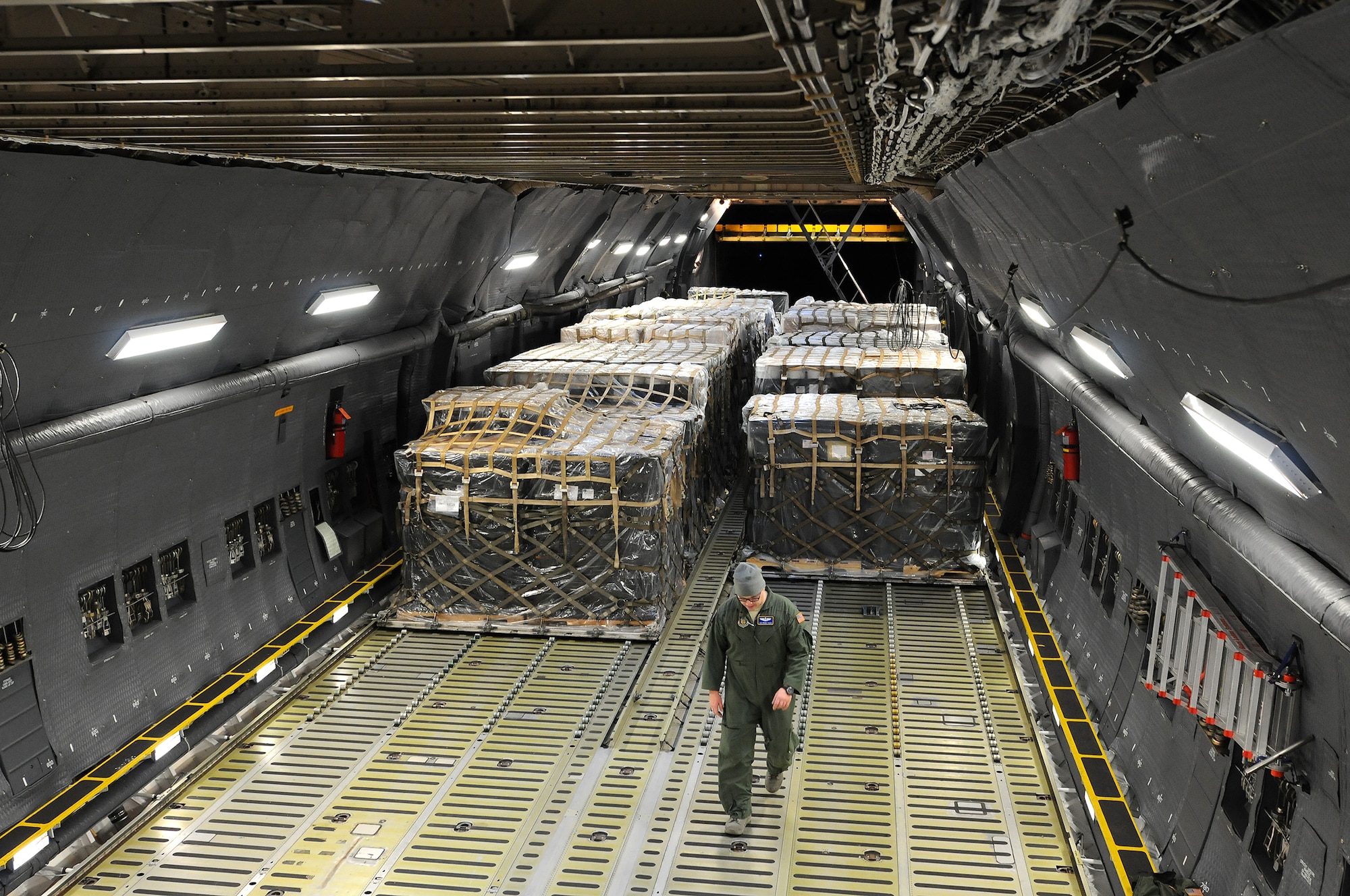 Reserve Airmen from the 512th Airlift Wing deliver humanitarian supplies to Nicaragua aboard a C-5M Super Galaxy Dec. 20, 2014, just in time for the holidays. The massive delivery was made possible through the Denton Program, a Defense Department humanitarian assistance transportation program that utilizes space available military air, surface and sea-lift assets. The supplies were provided to World Missions Outreach, which is an international nonprofit organization based in Nicaragua that provides food, education, medical and ministry services to the country's citizens. (U.S. Air Force photo/2nd Lt. Steve Lewis)