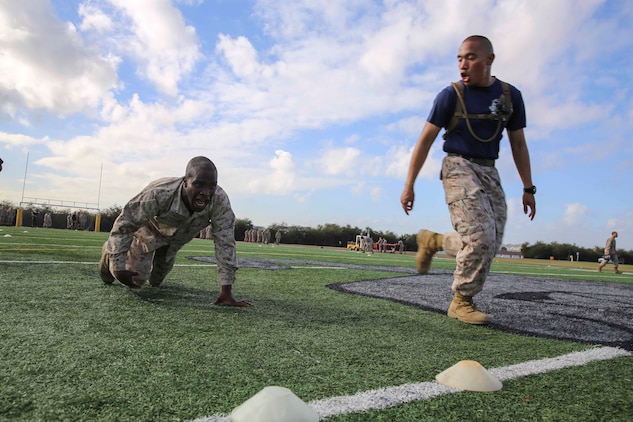 Private First Class Kanayochukwu Onyejeli, Platoon 3235, Kilo Company, 3rd Recruit Training Battalion, high crawls 10-yards during the maneuver under fire portion of the Combat Fitness Test at Marine Corps Recruit Depot San Diego, Calif., Dec. 22. The CFT is conducted in the Marine Corps Combat Utility Uniform and boots to simulate combat environments. There are three events in the CFT, each worth 100 points, leading to a perfect score of 300.
