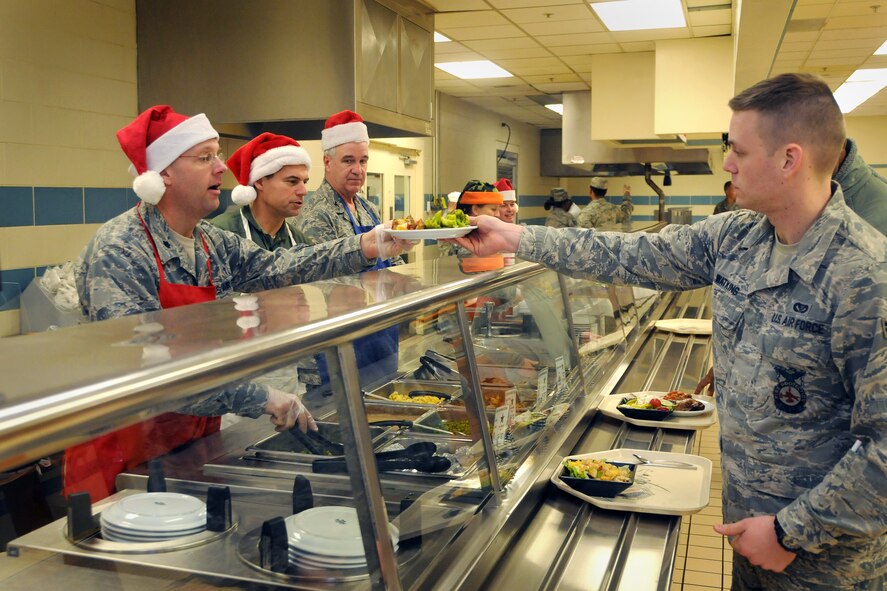 Members of 916th Air Refueling Wing leadership get into the holiday spirit by serving lunch at the Southern Eagle dining facility during the December drill weekend. (U.S. Air Force photo/Tech. Sgt. Scotty Sweatt)