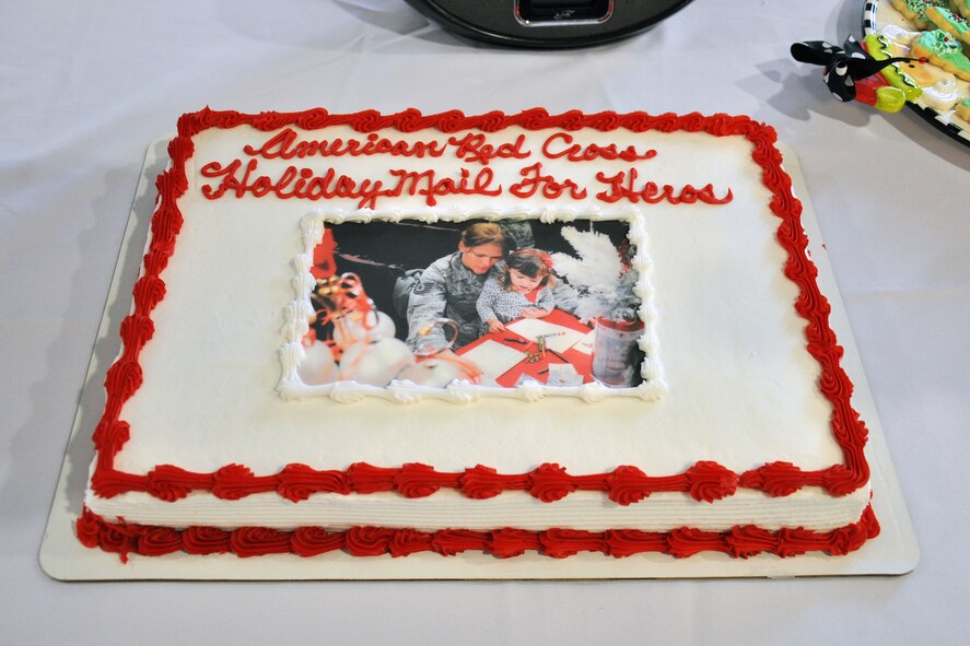 The “Holiday Mail for Heroes,” event was hosted by the 916th Air Refueling Wing and the American Red Cross, here for the third consecutive year. This cake from 2014 featured a photo of a 916th ARW Airmen and a family friend participating in last year’s holiday mail event. (U.S. Air Force photo/Staff Sgt. Alan Abernethy)