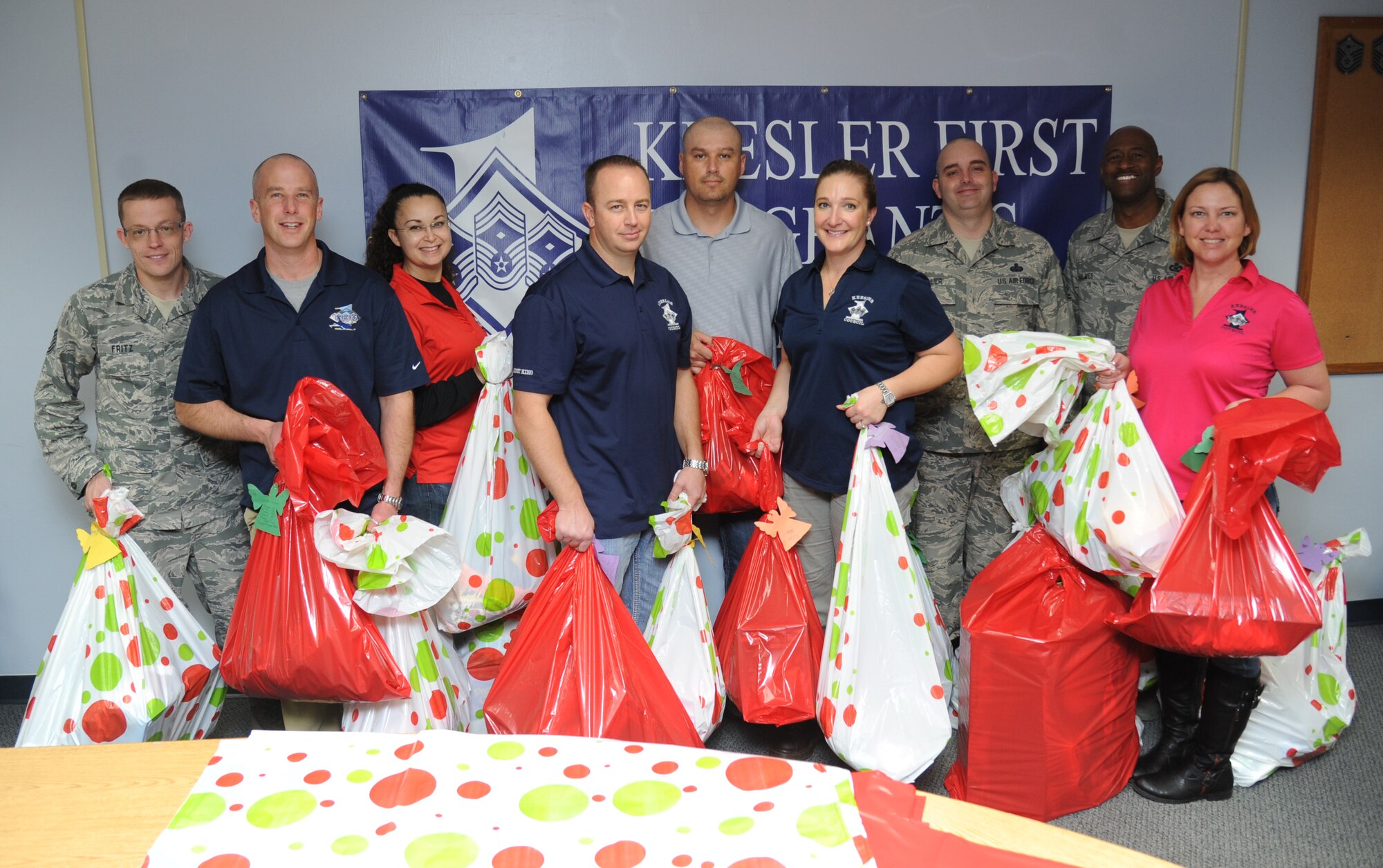 Members of the Keesler First Sergeants Council pose for a photo with gifts that were collected through the Diamond Angel Tree program Dec. 23, 2014, at Bryan Hall, Keesler Air Force Base, Miss.  The Diamond Angel Tree is a program sponsored by the Keesler First Sergeant Council, with a goal to provide gifts for children of our Keesler families for the holiday season.   (U.S. Air Force photo by Kemberly Groue)