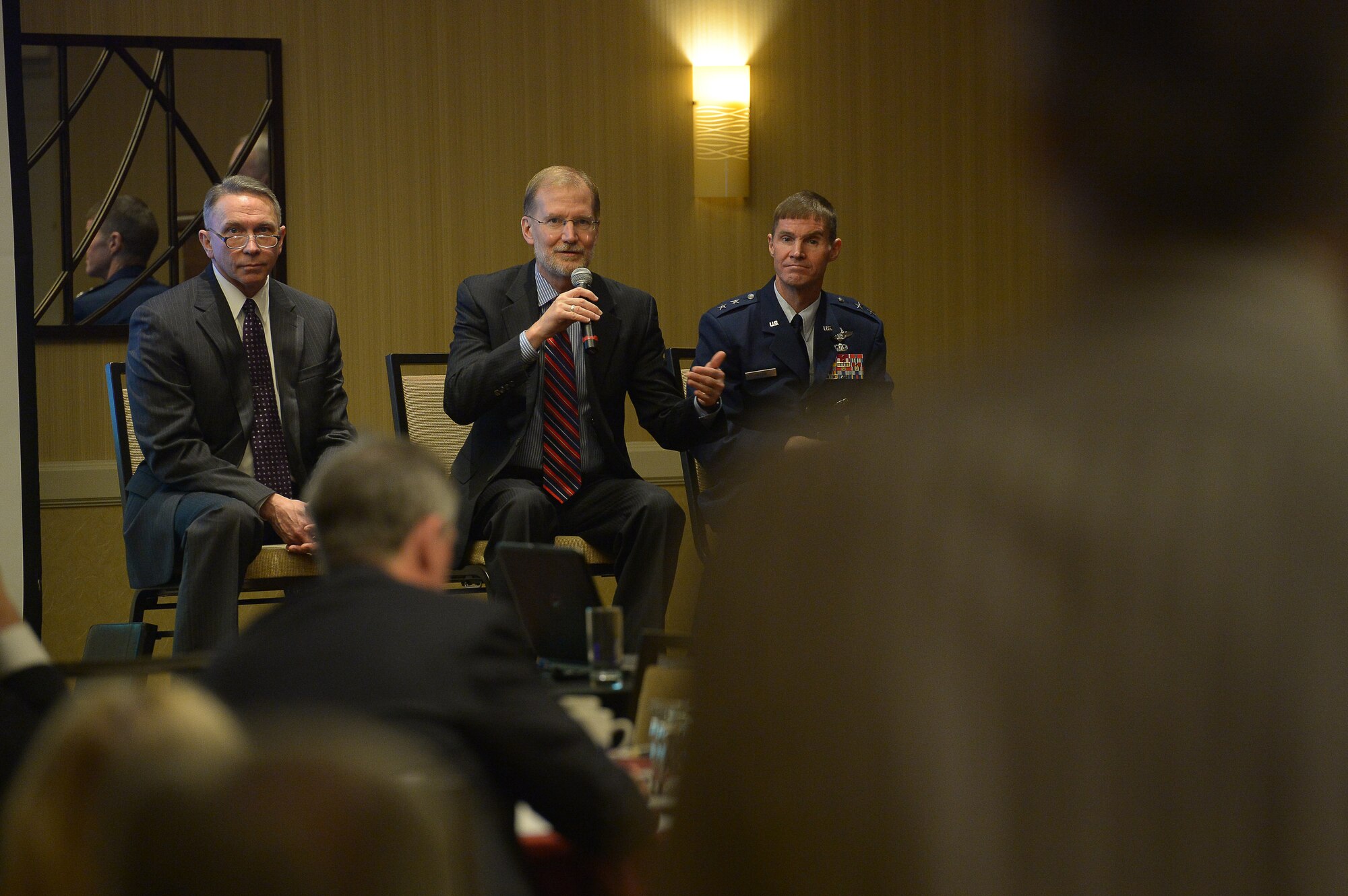 Steven Wert, program executive officer for Battle Management, Hanscom Air Force Base, Mass., answers a question from the audience as Scott A. Kiser, Air Force Life Cycle Management Center-Hanscom director of contracting, and U.S. Air Force Maj. Gen. Craig Olson, program executive officer for Command, Control, Communications, Intelligence and Networks, listen during the question and answer segment of a small business forum in Waltham, Mass., Dec. 18. The forum was hosted by the Commonwealth of Massachusetts’s Military Asset and Security Strategy Task Force.(U.S. Air Force photo by Jerry Saslav)
