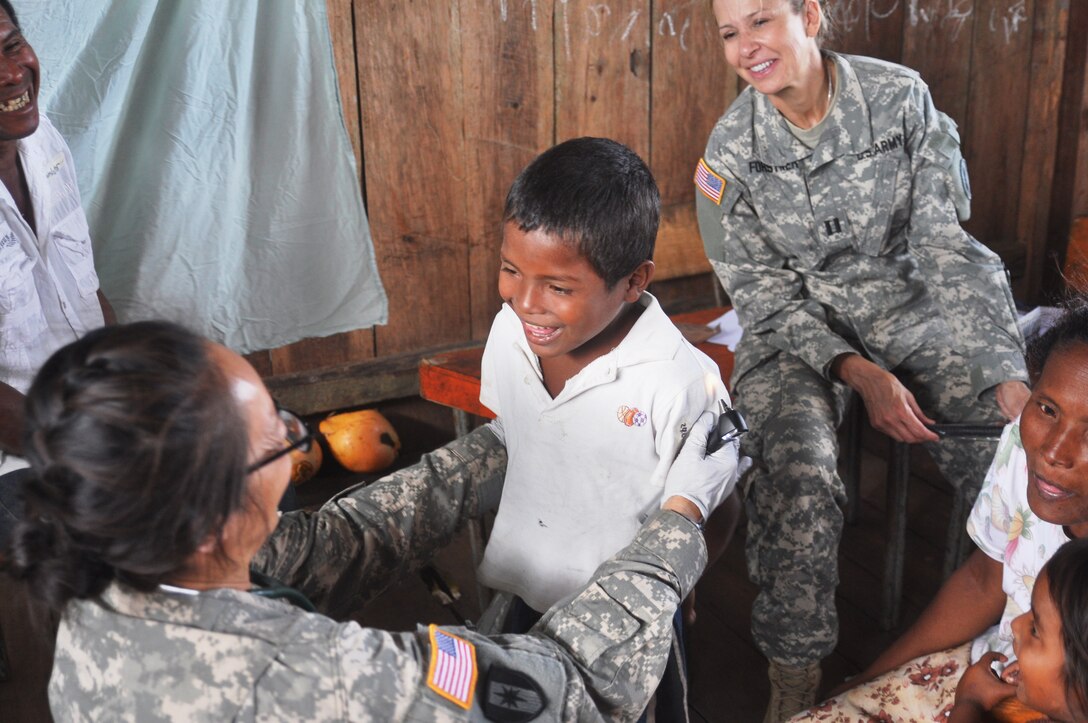 U.S. Army Maj. Juli Fung provides a medical screening for a Honduran child during a Medical Readiness Training Exercise in the Department of Gracias a Dios, Honduras. Dec. 17, 2014. Joint Task Force-Bravo’s Medical Element provided medical care to more than 1,500 Honduran citizens during the two-day MEDRETE operation. (Photo by U.S. Army Staff Sgt. Jason Tedesco)