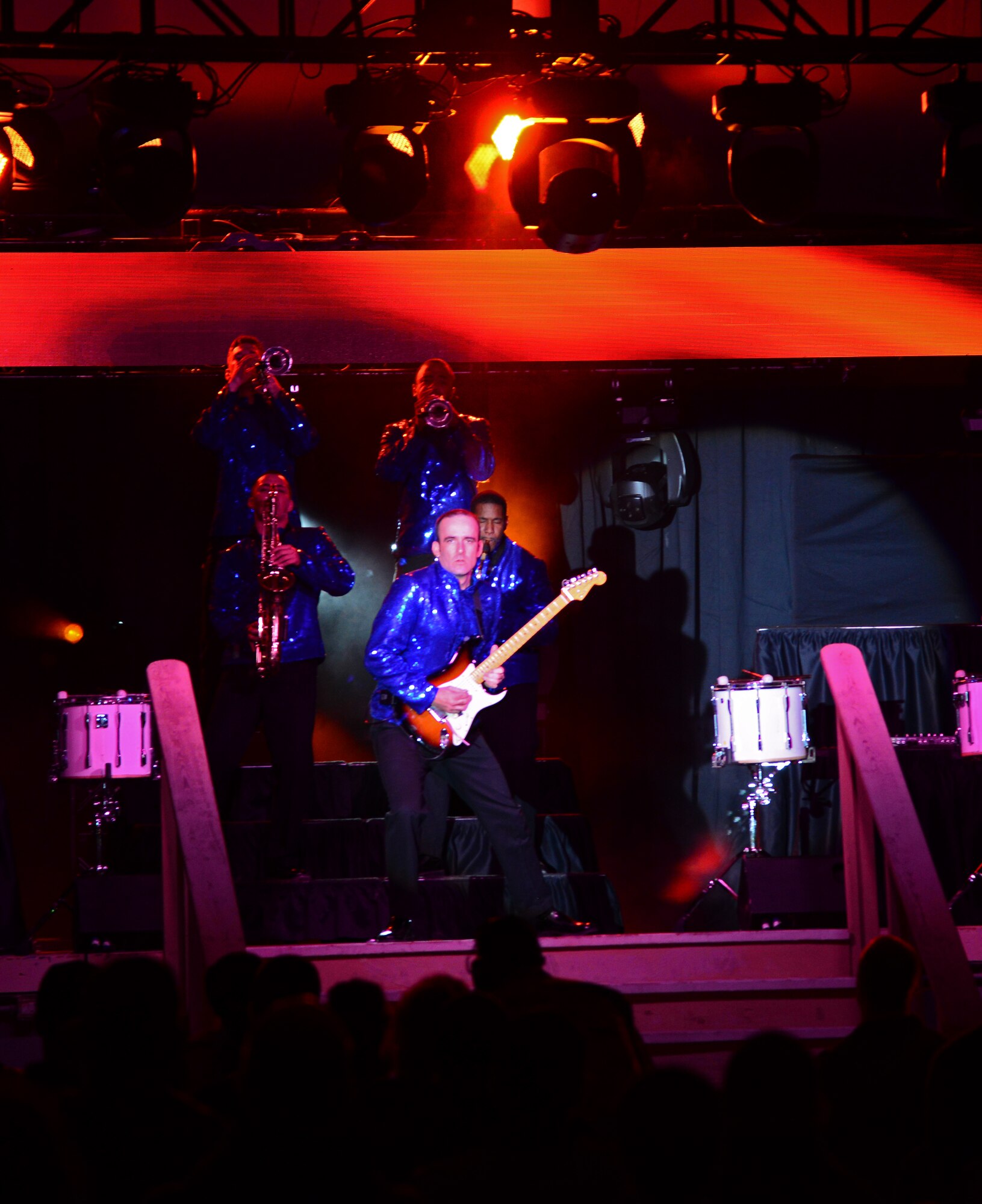 Airmen from Tops in Blue, the Air Force’s premiere entertainment showcase, perform for deployed U.S. servicemembers, Dec. 23, 2014, at Al Udeid Air Base, Qatar. Tops in Blue visited Al Udeid as part of their 2014 world tour, which provides music, song and dance to audiences in more than 85 locations.  For 60 years, Tops in Blue has provided the military community and public with world-wide performances. (U.S. Air Force photo by Senior Airman Kia Atkins)