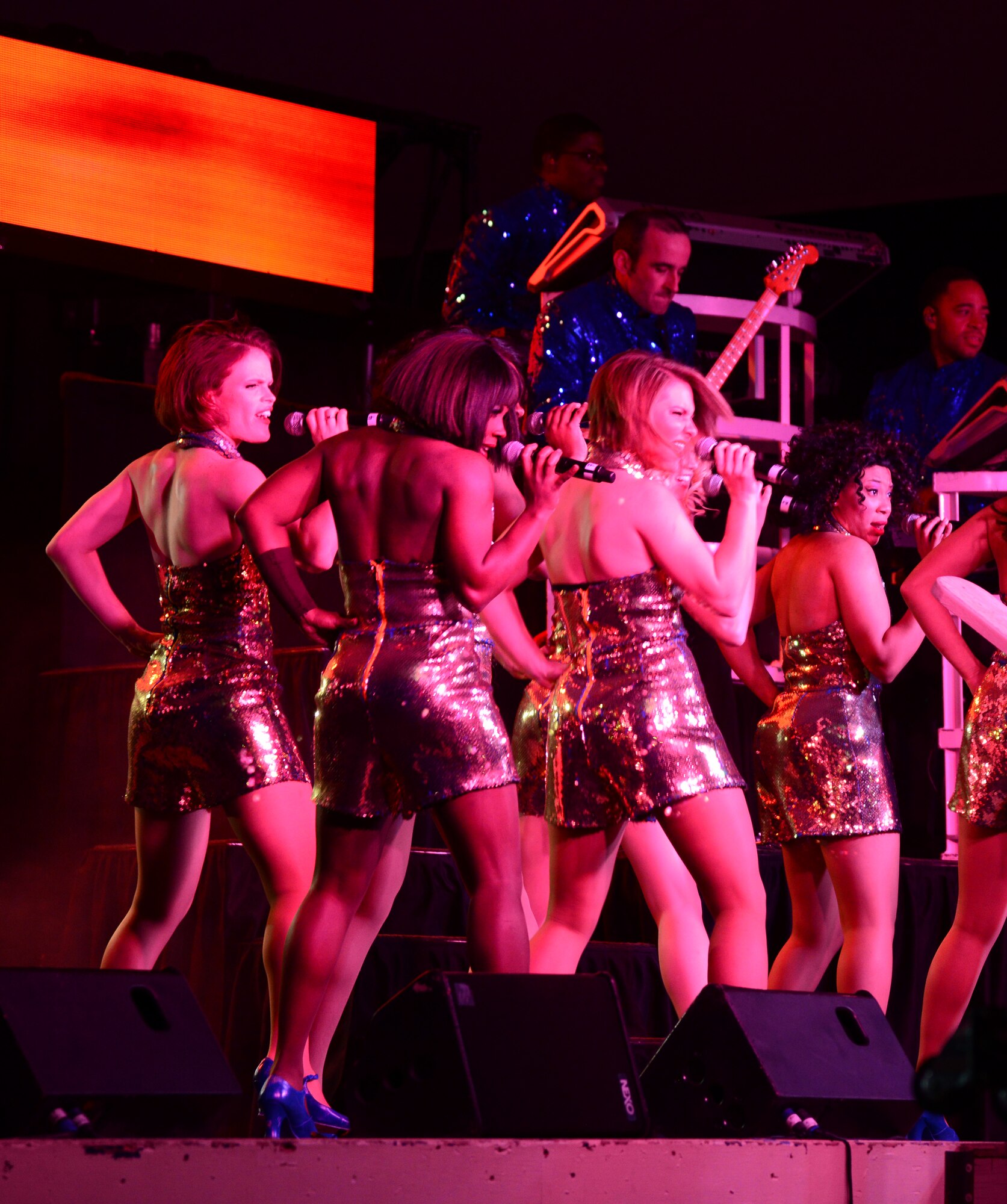 Airmen from Tops in Blue, the Air Force’s premiere entertainment showcase, perform for deployed U.S. servicemembers, Dec. 23, 2014, at Al Udeid Air Base, Qatar. Tops in Blue visited Al Udeid as part of their 2014 world tour, which provides music, song and dance to audiences in more than 85 locations.  For 60 years, Tops in Blue has provided the military community and public with world-wide performances. (U.S. Air Force photo by Senior Airman Kia Atkins)