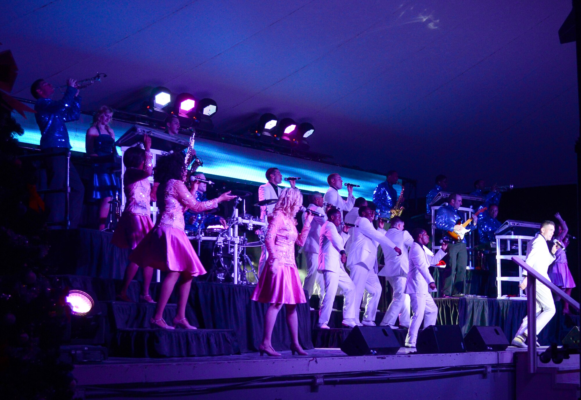 Airmen from Tops in Blue, the Air Force’s premiere entertainment showcase, perform for deployed U.S. servicemembersn, Dec. 23, 2014, at Al Udeid Air Base, Qatar. Tops in Blue visited Al Udeid as part of their 2014 world tour, which provides music, song and dance to audiences in more than 85 locations.  For 60 years, Tops in Blue has provided the military community and public with world-wide performances. (U.S. Air Force photo by Senior Airman Kia Atkins)