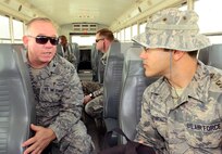 U.S. Air Force Col. Gerald Henry, 379th Air Expeditionary Wing chaplain (left), talks with Senior Airman Victor Garcia Fantauzzi, 379th Expeditionary Civil Engineer Squadron force protection security escort, during his visit with U.S. servicemembers deployed to Al Udeid Air Base, Qatar, Dec.23, 2014, as part of Operation Build Up Spirituality. The operation is an all-out effort by the Al Udeid chapel team, first sergeants and military and family life counselors to increase resiliency for U.S. servicemembers deployed far away from home and from loved ones during the holiday season. Garcia Fantauzzi is deployed from Whiteman Air Force Base, Mo. (U.S. Air Force photo by Master Sgt. Kerry Jackson)