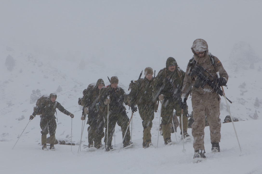 U.S. Marines with SPMAGTF Crisis Response – Africa, are guided by a Spanish Army mountaineer with 1st Mountain Troops Command, on a hike during mountain warfare training in Candanchu, Spain, Dec. 16, 2014. The exercise, which was conducted with the Spanish, allowed the Marines to gain greater knowledge of mountain warfare tactics, techniques and procedures while enhancing interoperability with the Spanish and strengthening the U.S. partnership with Spain. SPMAGTF-CR-AF is a self-mobile crisis response force that conducts missions to protect U.S. personnel, property, and interests in the U.S. Africa Command area of responsibility. (U.S. Marine Corps photo by Cpl. Jeraco Jenkins/Released)