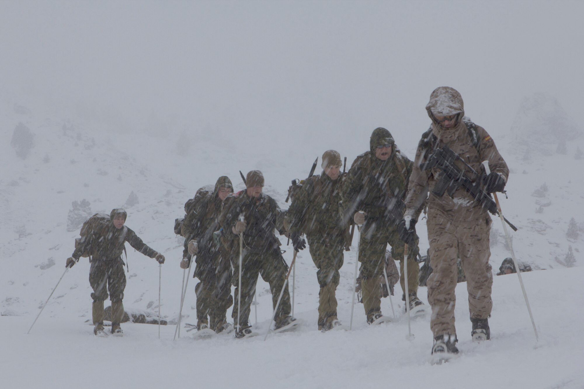 U.S. Marines with SPMAGTF Crisis Response – Africa, are guided by a Spanish Army mountaineer with 1st Mountain Troops Command, on a hike during mountain warfare training in Candanchu, Spain, Dec. 16, 2014. The exercise, which was conducted with the Spanish, allowed the Marines to gain greater knowledge of mountain warfare tactics, techniques and procedures while enhancing interoperability with the Spanish and strengthening the U.S. partnership with Spain. SPMAGTF-CR-AF is a self-mobile crisis response force that conducts missions to protect U.S. personnel, property, and interests in the U.S. Africa Command area of responsibility. (U.S. Marine Corps photo by Cpl. Jeraco Jenkins/Released)