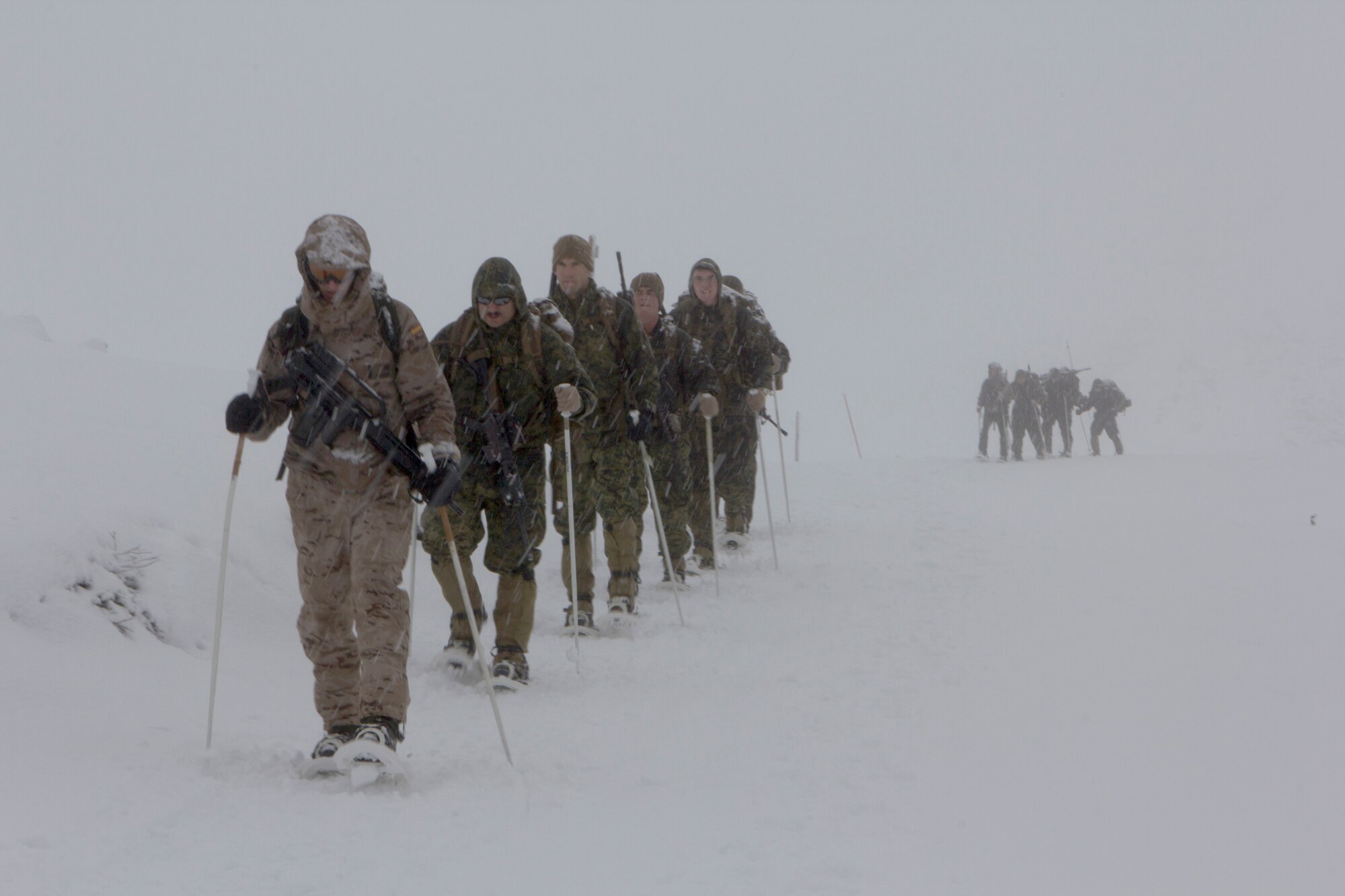 U.S. Marines with SPMAGTF Crisis Response – Africa, are guided by a Spanish Army mountaineer with 1st Mountain Troops Command on a hike during mountain warfare training in Candanchu, Spain, Dec. 16, 2014. The exercise, which was conducted with the Spanish, allowed the Marines to gain greater knowledge of mountain warfare tactics, techniques and procedures while enhancing interoperability with the Spanish and strengthening the U.S. partnership with Spain. SPMAGTF-CR-AF is a self-mobile crisis response force that conducts missions to protect U.S. personnel, property and interests in the U.S. Africa Command area of responsibility. (U.S. Marine Corps photo by Cpl. Jeraco Jenkins/Released)