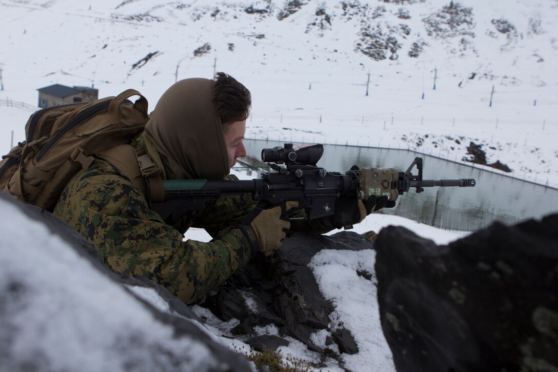 U.S. Marine Lance Cpl. Michael Civiarella, a rifleman with SPMAGTF Crisis Response – Africa, sits in a defensive position in snow during mountain warfare training in Candanchu, Spain, Dec. 16, 2014. The exercise, which was conducted with the Spanish, allowed the Marines to gain greater knowledge of mountain warfare tactics, techniques and procedures while enhancing interoperability with the Spanish and strengthening the U.S. partnership with Spain. SPMAGTF-CR-AF is a self-mobile crisis response force that conducts missions to protect U.S. personnel, property and interests in the U.S. Africa Command area of responsibility. (U.S. Marine Corps photo by Cpl. Jeraco Jenkins/Released)