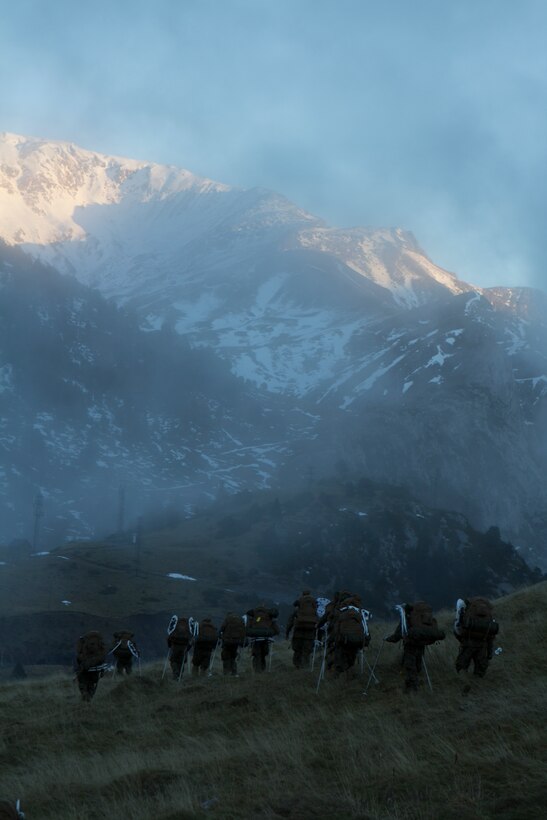 U.S. Marines with SPMAGTF Crisis Response – Africa, and Spanish Army mountaineers with 1st Mountain Troops Command, hike though alongside each other during mountain warfare training in Candanchu, Spain, Dec. 16, 2014. The exercise, which was conducted with the Spanish, allowed the Marines to gain greater knowledge of mountain warfare tactics, techniques and procedures while enhancing interoperability with the Spanish and strengthening the U.S. partnership with Spain.  SPMAGTF-CR-AF is a self-mobile crisis response force that conducts missions to protect U.S. personnel, property, and interests in the U.S. Africa Command area of responsibility. (U.S. Marine Corps photo by Cpl. Jeraco Jenkins/Released)