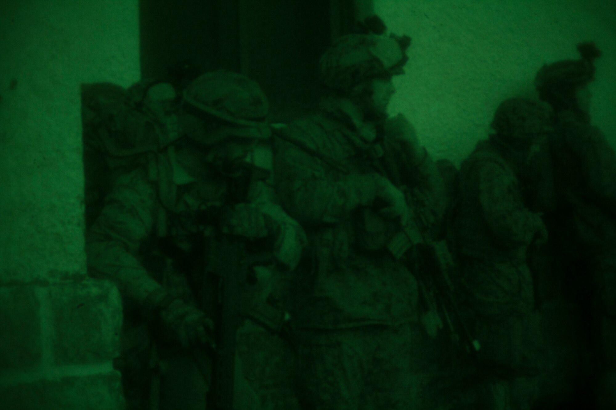 U.S. Marines, with SPMAGTF Crisis Response – Africa, take cover being a wall during an urban assault with the Spanish mountaineers with 1st Mountain Troops Command, as part of mountain warfare training in Candanchu, Spain, Dec. 16, 2014. The exercise, which was conducted with the Spanish, allowed the Marines to gain greater knowledge of mountain warfare tactics, techniques and procedures while enhancing interoperability with the Spanish and strengthening the U.S. partnership with Spain.  SPMAGTF-CR-AF is a self-mobile crisis response force that conducts missions to protect U.S. personnel, property, and interests in the U.S. Africa Command area of responsibility. (U.S. Marine Corps photo by Cpl. Jeraco Jenkins/Released)