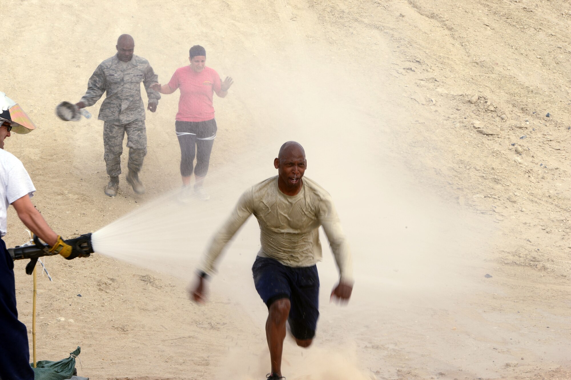 SOUTHWEST ASIA - Master Sgt. Ivory Carter, 386th Expeditionary Civil Engineer Squadron Fire Department, finishes the 386th Air Expeditionary Wing Warrior Challenge on Dec. 27, 2014. The course took approximately 48 hours to set up and included a 5K run and an obstacle course. (U.S. Air Force photo by Tech. Sgt. Jared Marquis/released)