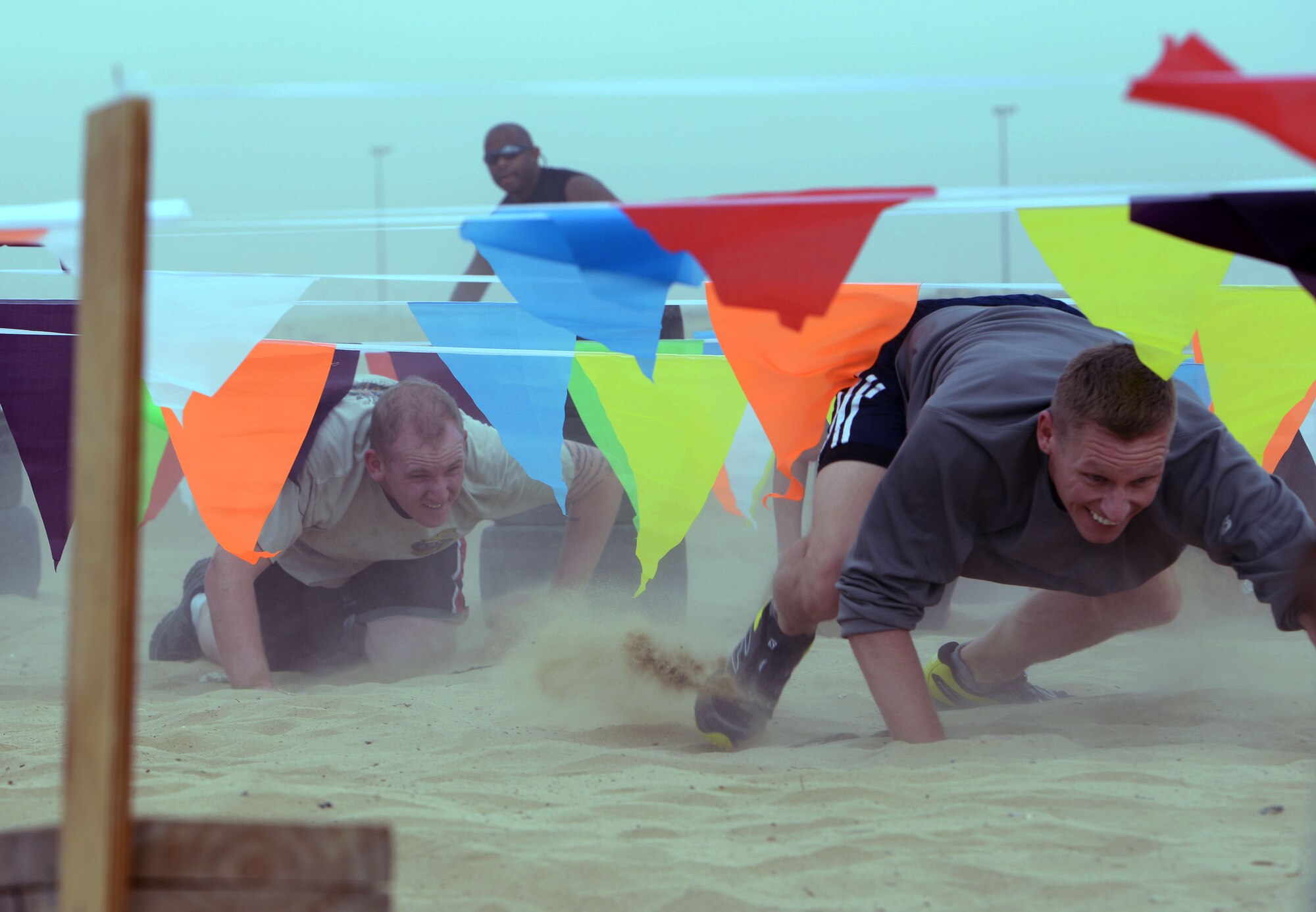 SOUTHWEST ASIA - Marauders navigate the bear crawl event during the 386th Air Expeditionary Wing Warrior Challenge on Dec. 27, 2014. The course took approximately 48 hours to set up and included a 5K run and an obstacle course. (U.S. Air Force photo by Tech. Sgt. Jared Marquis/released)