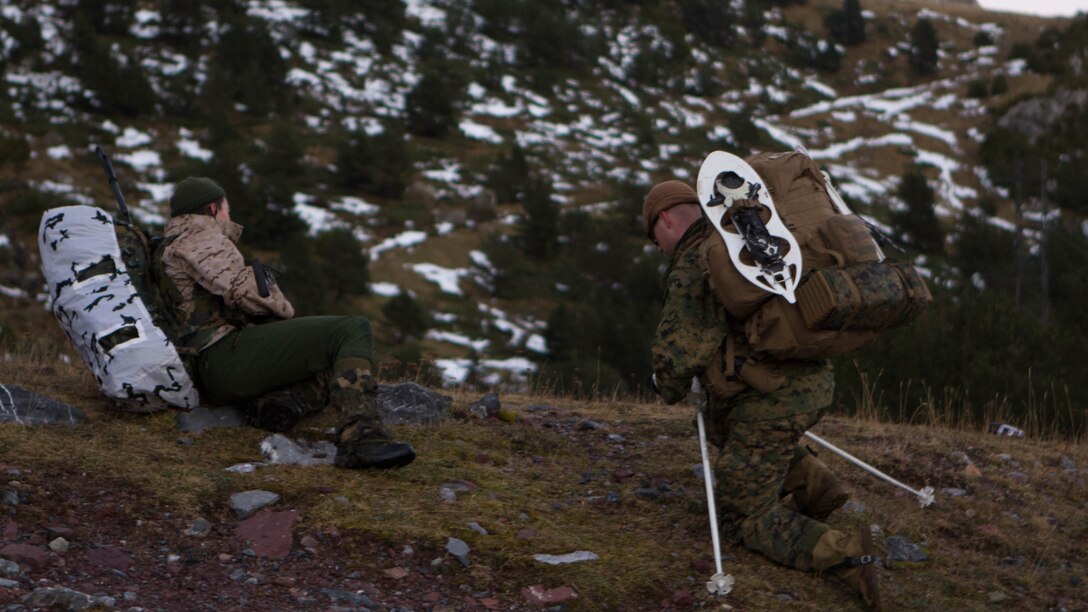 U.S. Marine Capt. Nathan D. Bedle, with Special Purpose Marine Air-Ground Task Force Crisis Response – Africa, and a Spanish soldier with 1st Mountain Troops Command conduct a trail recon  a during mountain warfare training in Candanchu, Spain, Dec. 16, 2014. The exercise, which was conducted with the Spanish, allowed the Marines to gain greater knowledge of mountain warfare tactics, techniques and procedures while enhancing interoperability with the Spanish and strengthening the U.S. partnership with Spain.  SPMAGTF-CR-AF is a self-mobile crisis response force that conducts missions to protect U.S. personnel, property, and interests in the U.S. Africa Command area of responsibility. 