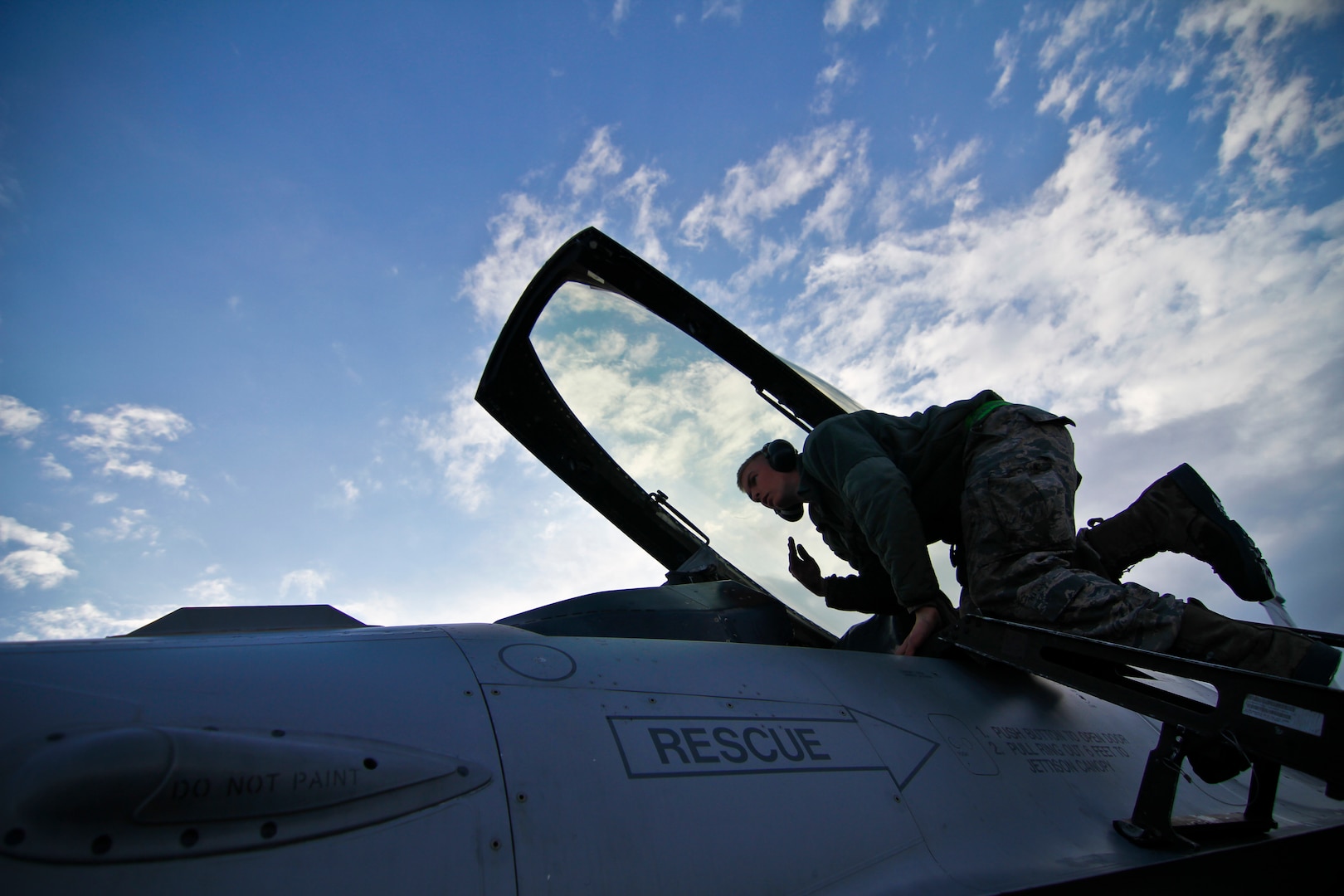 U.S. Air Force Airman 1st Class Jordan DeAngelis signals during a power check on an F-16C Fighting Falcon on Feb 4, 2012, at Bagram Air Field, Afghanistan.  DeAngelis is an F-16C crew chief deployed from the 177th Fighter Wing, New Jersey Air National Guard. Officials announced the conclusion of combat operations in Afghanistan.