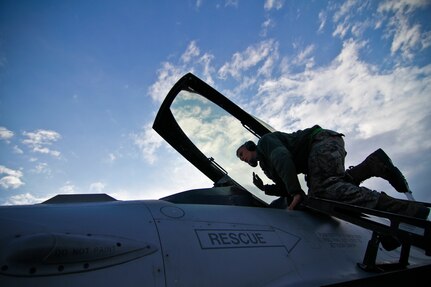 U.S. Air Force Airman 1st Class Jordan DeAngelis signals during a power check on an F-16C Fighting Falcon on Feb 4, 2012, at Bagram Air Field, Afghanistan.  DeAngelis is an F-16C crew chief deployed from the 177th Fighter Wing, New Jersey Air National Guard. Officials announced the conclusion of combat operations in Afghanistan.