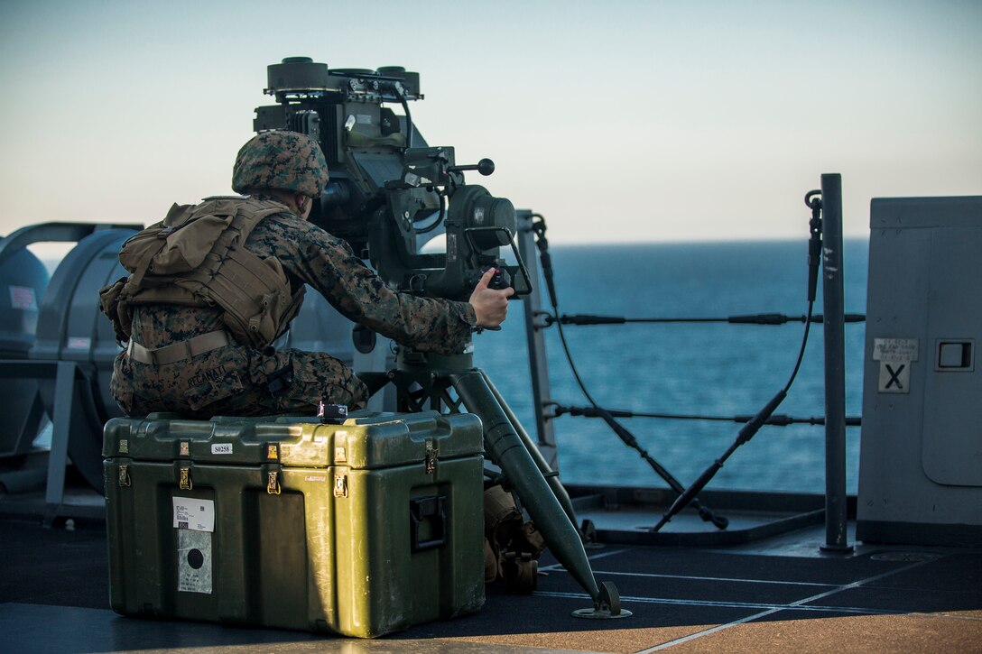 Lance Cpl. Ryan Recanati, an anti-tank missileman with Weapons Company, Battalion Landing Team 3rd Battalion, 6th Marine Regiment, 24th Marine Expeditionary Unit, looks through the optics of an M41 Saber System aboard the USS New York, at sea, Dec. 25, 2014. Recanati was part of a defensive posture for the ship as it sailed through the Strait of Gibraltar on its way into the Mediterranean Sea. The Iwo Jima Amphibious Ready Group/24th Marine Expeditionary Unit, is conducting naval operations in the U.S. 6th Fleet area of operations in support of U.S. national security interests in Europe. 