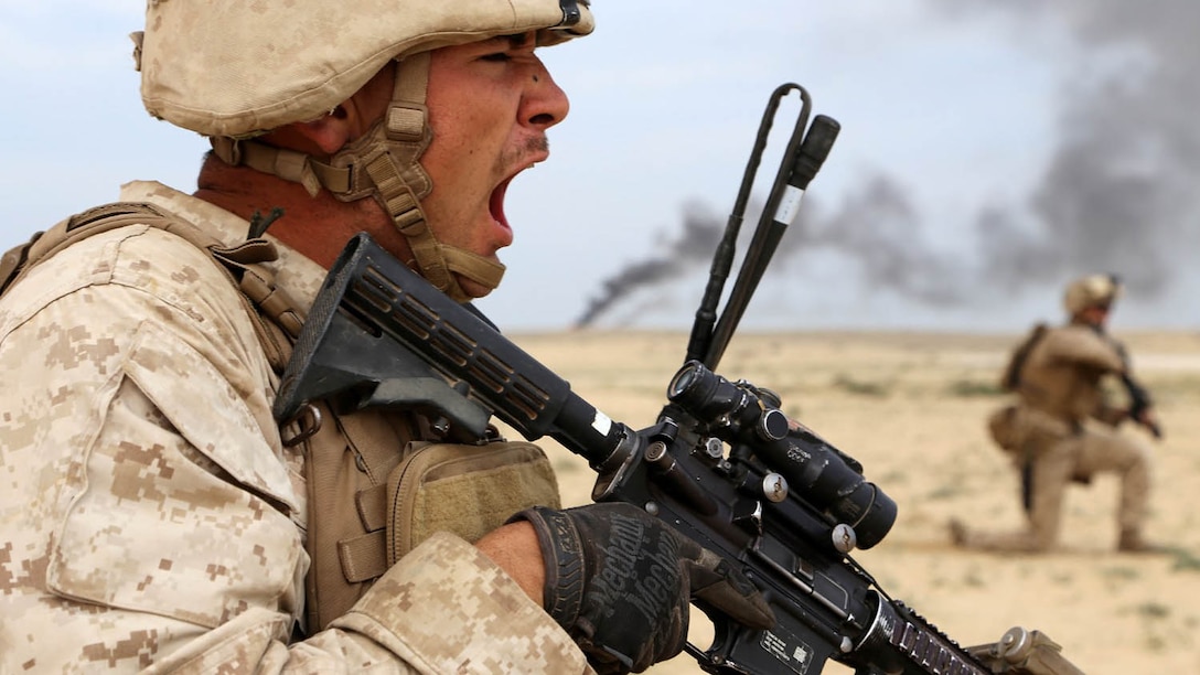 U.S. Marine Corps Cpl. Ty-Michael Maes, left, a team leader with the 1st Light Armored Reconnaissance detachment, Battalion Landing Team, 2nd Battalion, 1st Marines, 11th Marine Expeditionary Unit, and native of Lindenhurst, New York, directs his fire team during a bilateral live-fire assault exercise with Saudi Marines as part of exercise Red Reef 15 in Ras Al Khair, Saudi Arabia. Red Reef is part of a routine theater security cooperation engagement plan between the U.S. Navy, U.S. Marine Corps and Royal Saudi Naval Forces that serves as an excellent opportunity to strengthen tactical proficiency in critical mission areas and support long-term regional security. (U.S. Marine Corps photos by Gunnery Sgt. Rome M. Lazarus/Released)