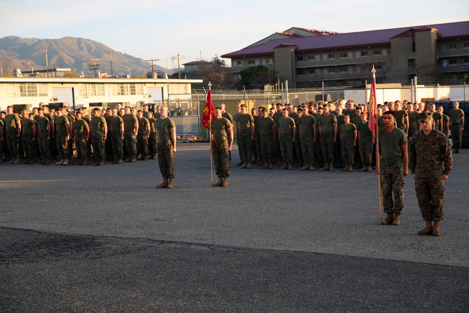 Marines with 1st Maintenance Battalion, Combat Logistics Regiment 15, 1st Marine Logistics Group, stand at the position of attention during an award ceremony aboard Camp Pendleton, California, Dec. 19, 2014. (Marine Corps photo by Cpl. Cody Haas/ Released)