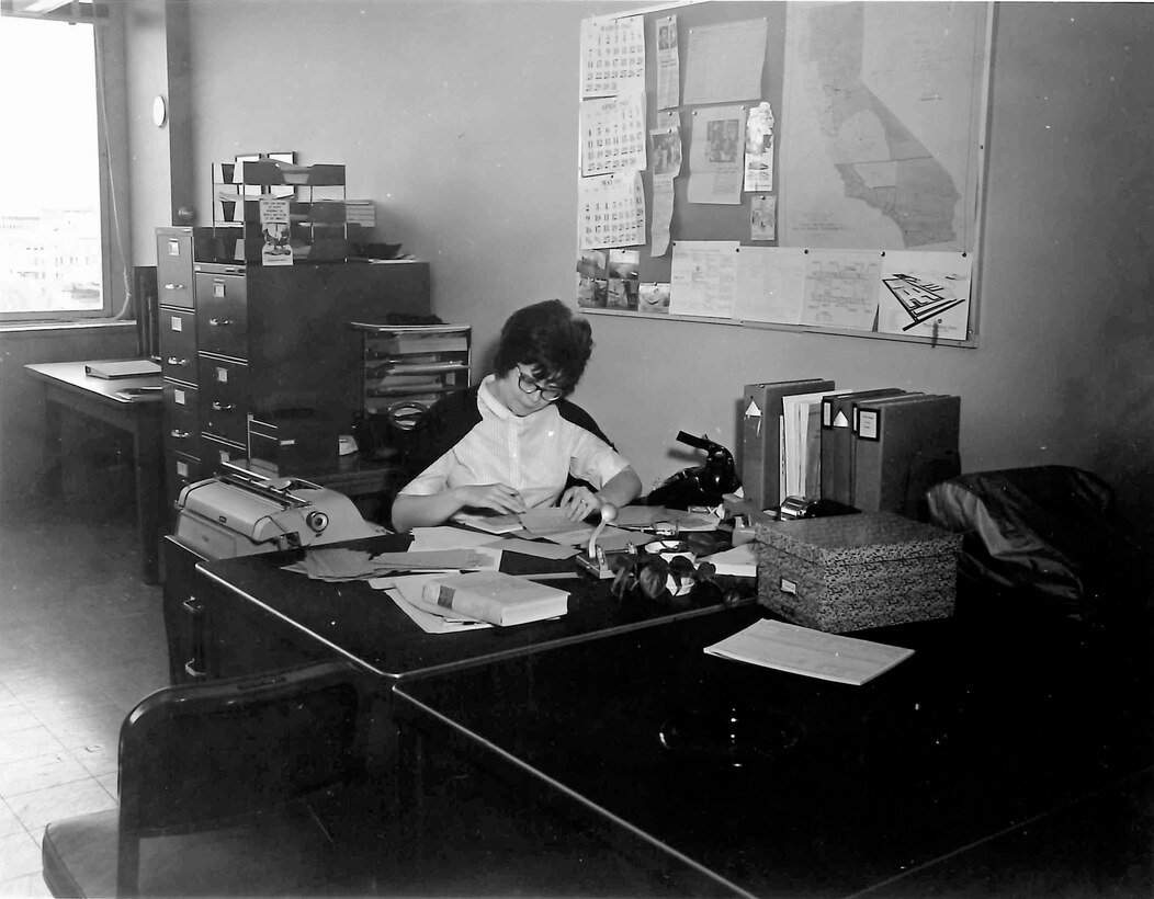Sharon Caine, U.S. Army Corps of Engineers Sacramento District real estate division chief, is seen here in the mid 1960s while working in the district’s engineering division, civil defense branch. At that time, the district surveyed buildings to determine suitability for fallout shelters. Caine will retire at the end of 2014 after having served the U.S. Army Corps of Engineers for 54 years. Most of that time was spent with the Corps’ Sacramento District. 