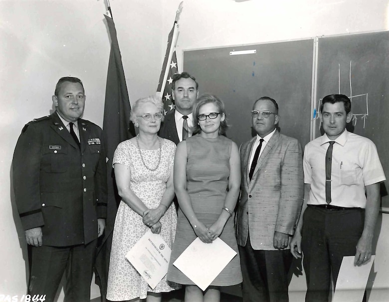 Sharon Caine (center), U.S. Army Corps of Engineers Sacramento District real estate division chief, stands with other district employees after receiving awards from the district commander for the work with the Combined Federal Campaign in the 1960s. Caine will retire at the end of 2014 after serving the U.S. Army Corps of Engineers for 54 years. Most of that time was spent with the Corps’ Sacramento District.