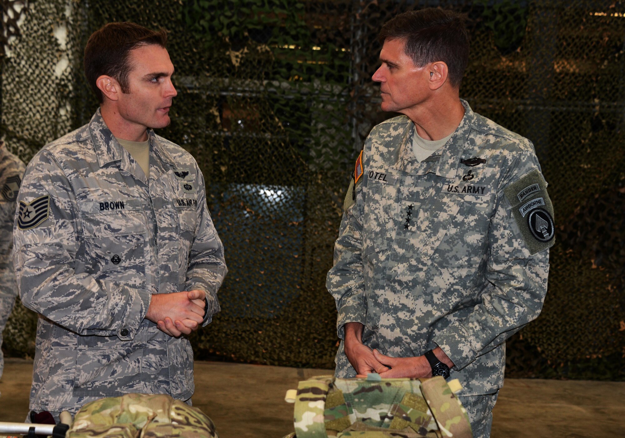 From left, Tech. Sgt. Joshua Brown, a pararescueman with the 320th Special Tactics Squadron, briefs U.S. Army Gen. Joseph Votel, during a visit Dec. 15, 2014 at Kadena Air Base, Japan.  As commander of the U.S. Special Operations Command, Votel directs all U.S. Special Operations Forces and is in charge of organizing, training, equipping and deploying special operators such as the Air Commandos of the 353rd Special Operations Group. (U.S. Air Force photo by Tech. Sgt. Kristine Dreyer)