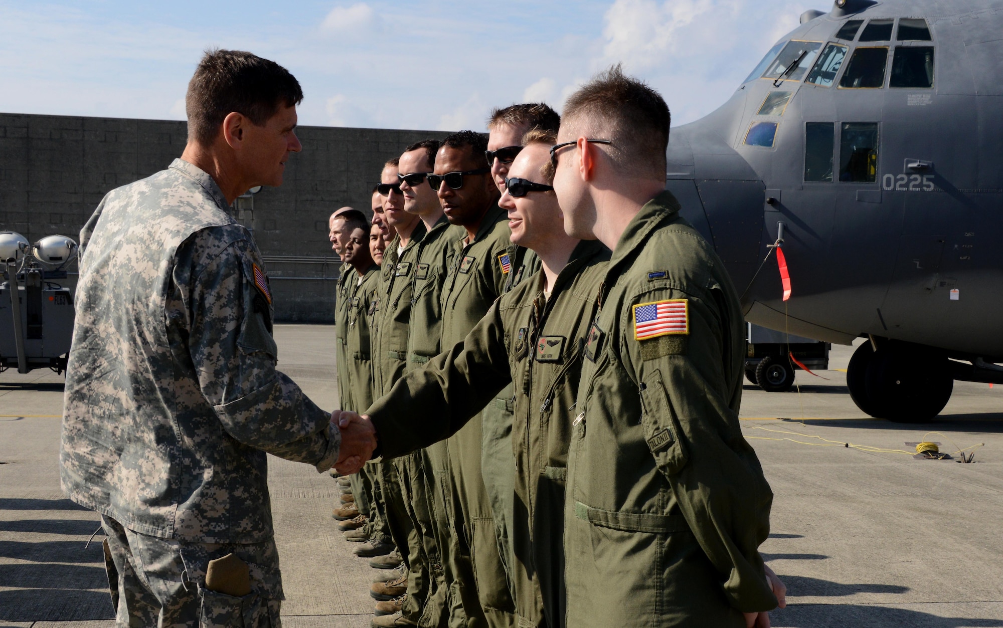 U.S. Army Gen.  Joseph Votel, commander of U.S. Special Operations Command shakes hands with Capt. Christopher Horn, a copilot at the 1st Special Operations Squadron, during a tour of the flightline Dec. 15, 2014 on Kadena Air Base, Japan.  Votel directs all U.S. Special Operations Forces and is in charge of organizing, training, equipping and deploying special operators such as the Air Commandos of the 353rd Special Operations Group. (U.S. Air Force photo by Tech. Sgt. Kristine Dreyer) 