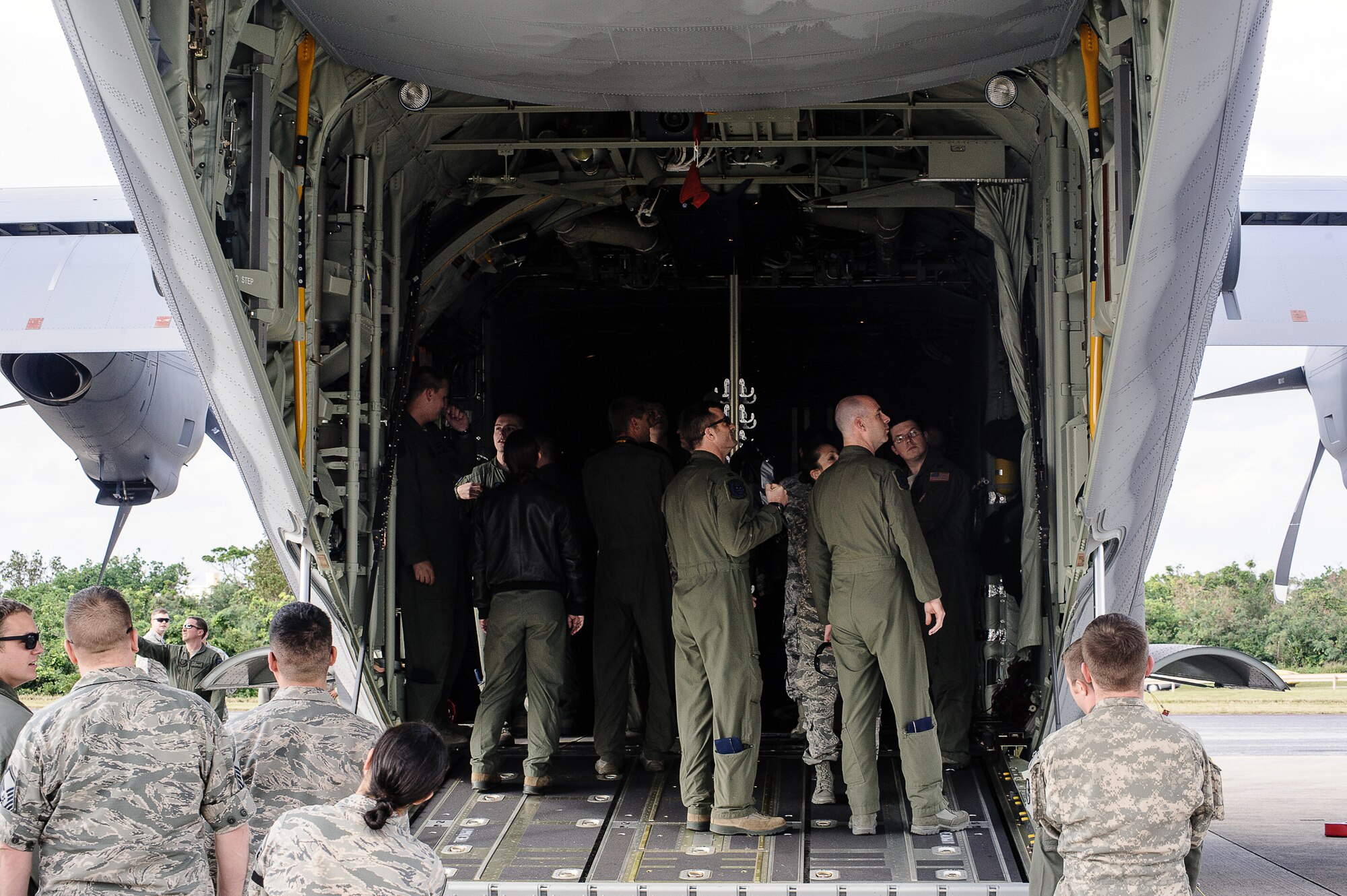 A MC-130J Commando II extends its landing gear above the flightline on Kadena Air Base, Japan, Dec. 21, 2014. The MC-130J will replace the MC-130P Combat Shadow aircraft assigned to the 353rd Special Operations Group’s 17th Special Operations Squadron. (U.S. Air Force photo by Tech. Sgt. Alexy Saltekoff)