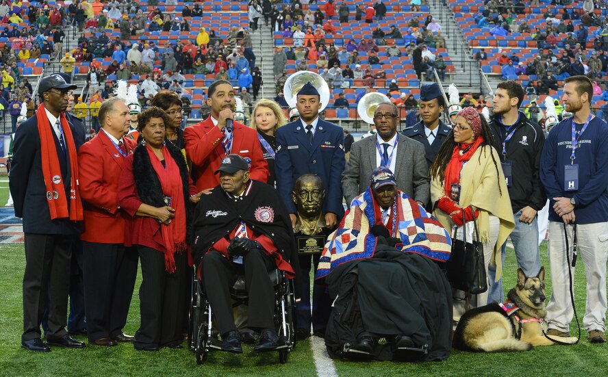Tuskegee Airmen Homer Hogues and Calvin Spann receive the Omar N. Bradley "Spirit of Independence Award" on behalf of all of the Tuskegee Airmen during the Duck Commander Independence Bowl at Shreveport, La., Dec. 27, 2014. The Omar N. Bradley "Spirit of Independence Award" is named after the last individual in the United States Armed Forces to hold the 5-star rank. It was named after him because he embodied the spirit of independence. (U.S. Air Force photo/Senior Airman Joseph A. Pagán Jr.)