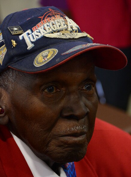 Calvin Spann, a Tuskegee Airman, listens to a briefing given by B-52H Stratofortress aviators and maintainers during a visit to Barksdale Air Force Base, La., Dec. 27, 2014. Spann visited Barksdale to meet with Airmen and talk to them about the past and current generation of aviation. (U.S. Air Force photo/Senior Airman Benjamin Gonsier)