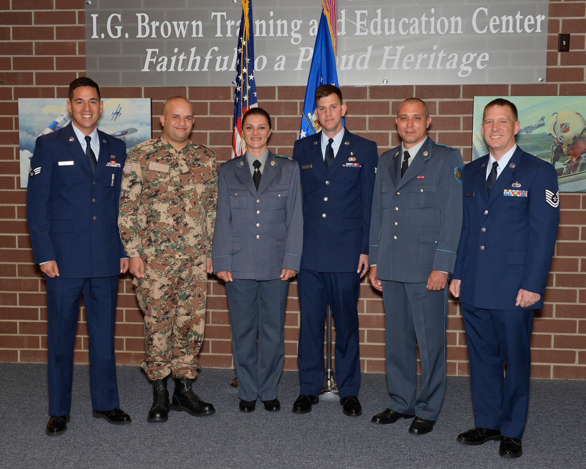 MCGHEE TYSON AIR NATIONAL GUARD BASE, Tenn. - Bulgarian and Jordan  service members take a photo with fellow U.S. Airmen who supported them during Airman Leadership School and NCO Academy here April 4, 2014, at the I.G. Brown Training and Education Center. (U.S. Air National Guard photo by Master Sgt. Kurt Skoglund/Released)
