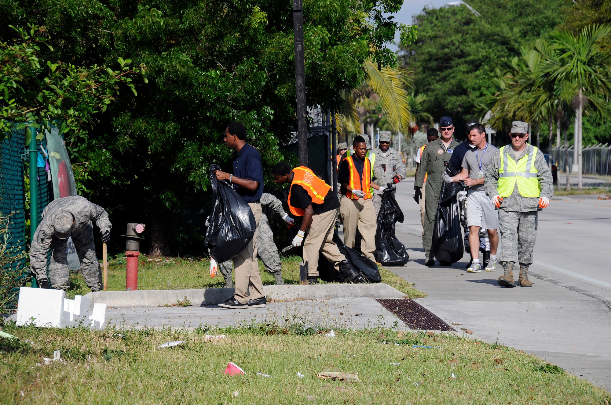 Members of Team Homestead and the Homestead Job Corps pick-up trash during one of four clean-ups on SW 288th Street on May 8. (U.S. Air Force photo/Tim Norton)