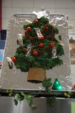 A broccoli and tomato Christmas tree stands on display at the Weapons Station Galley, Dec. 25, 2014, at Joint Base Charleston, S.C. Cheryl Cote and Elizabeth Bohr, Galley line supervisors, were asked to add ambiance for the Sailors by creating decorations from readily available kitchen items. The Galley staff and their Air Force counterparts at the Gaylor Dining Facility on the Air Base, prepared delicious meals for service members at Joint Base Charleston, many of whom are stationed away from friends and families. (U.S. Air Force photo/Capt. Christopher Love)